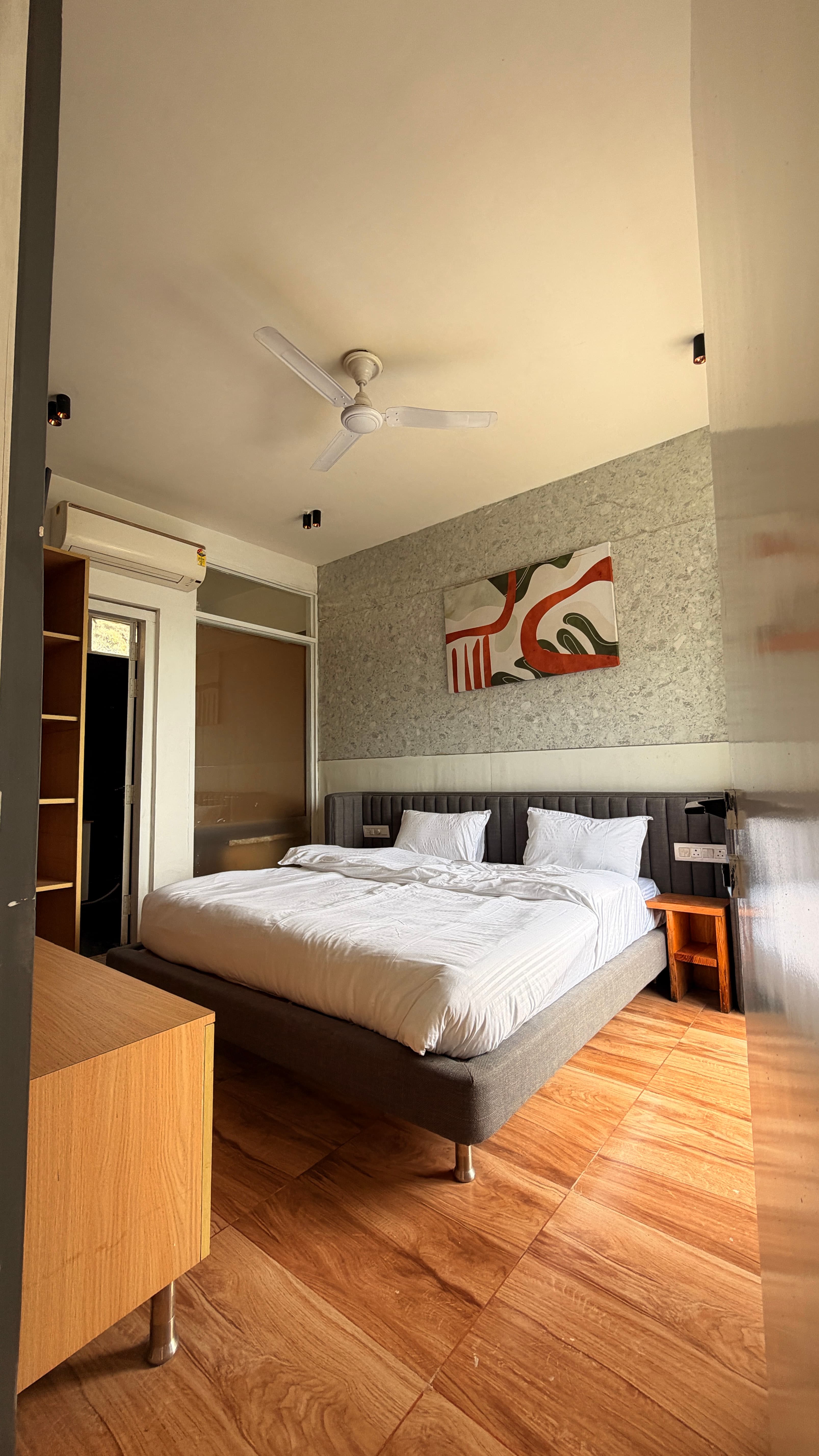 Bedroom with stone accent wall